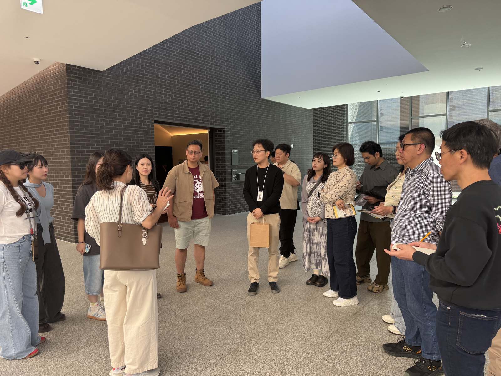 A study-tour group on a technical site visit in Korea